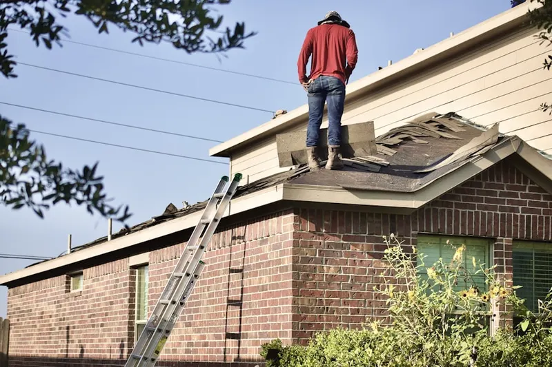 Professional roofer working on a residential roof in New Port Richey